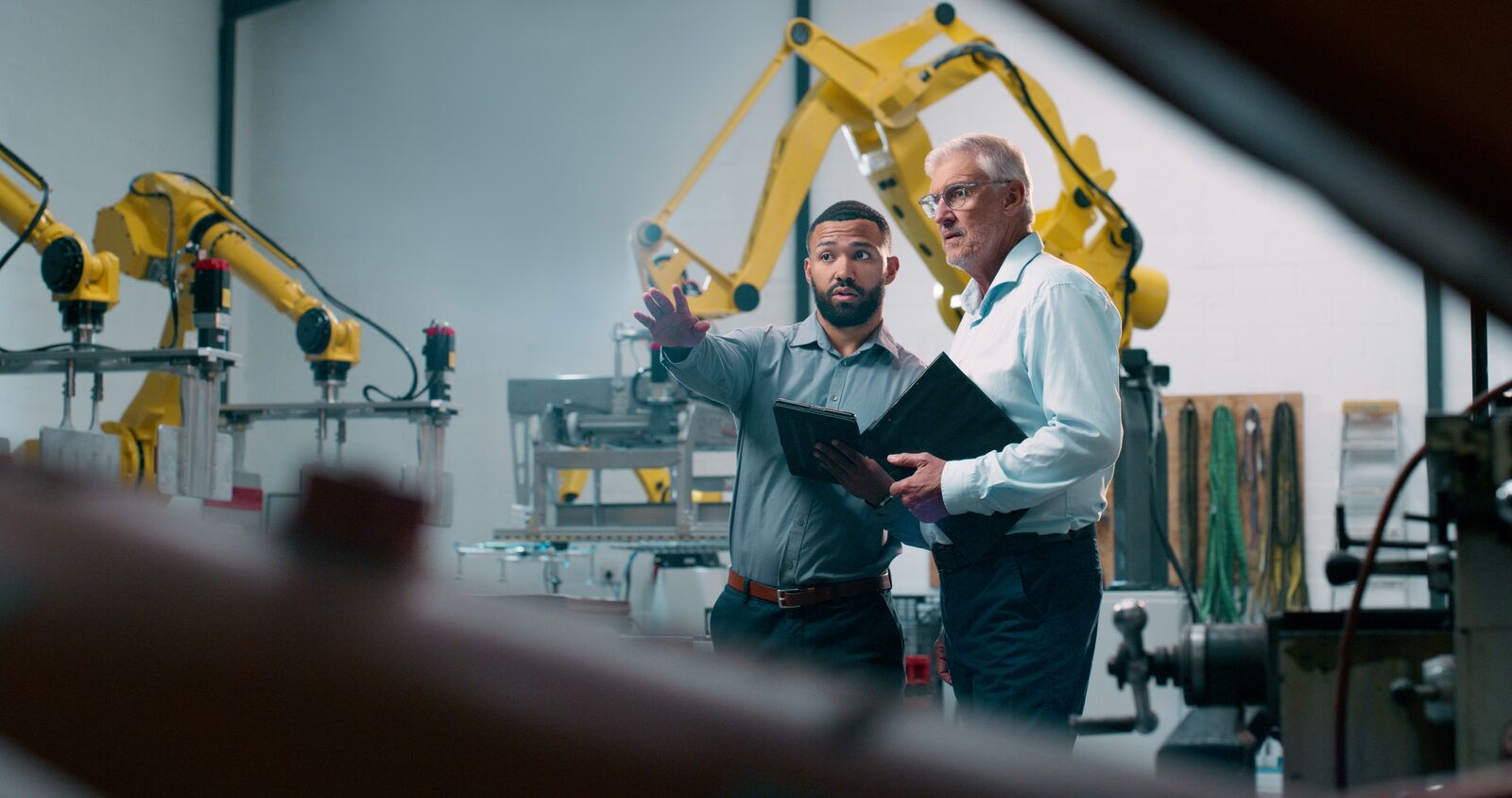 Engineer using a tablet in an industrial setting
